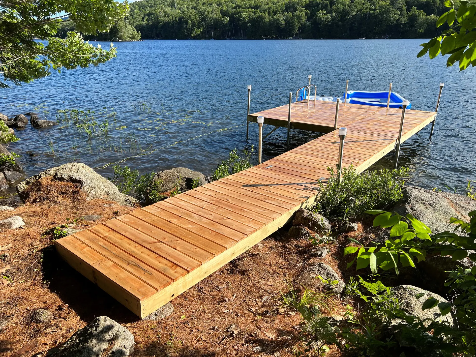 Modern floating dock with boat lift and solar panel
