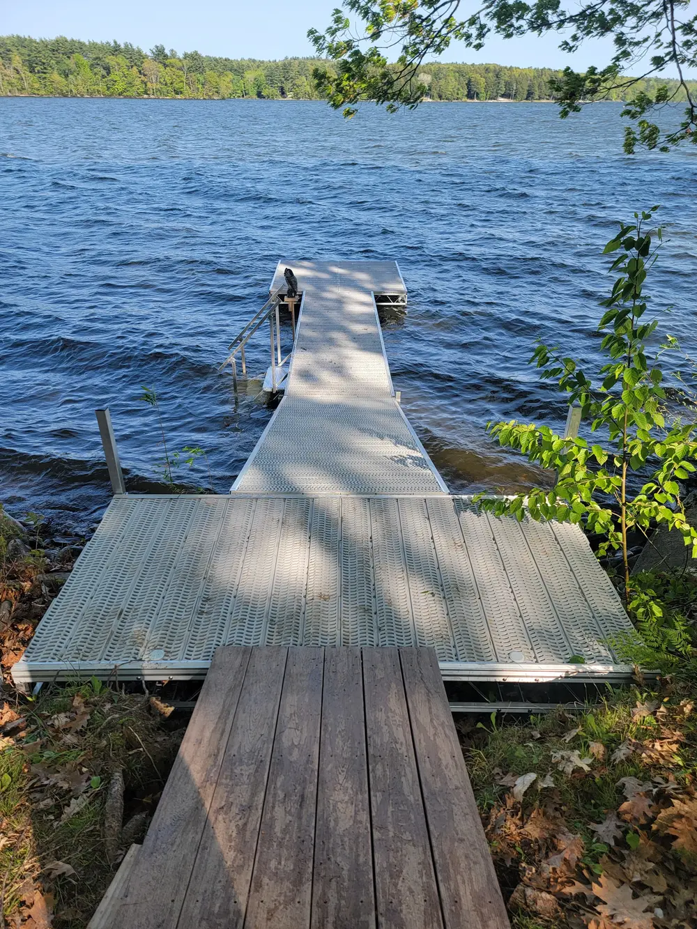 Stationary dock with aluminum frame and wooden decking