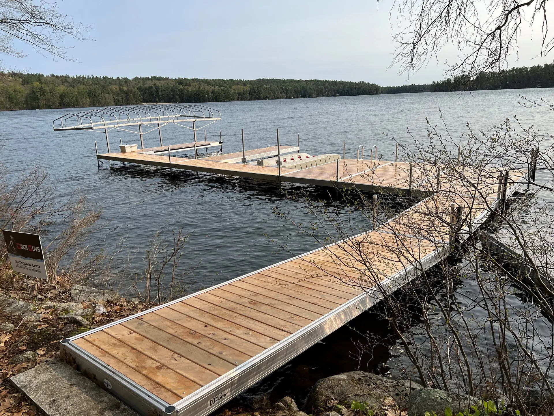 Modern floating dock with boat lift and solar panel